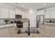 Stylish kitchen boasts granite countertops, a stainless steel sink, and white cabinets at 100 Academy Ln, Canton, GA 30114