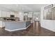 Open kitchen with island, granite countertops, and stainless steel appliances at 100 Academy Ln, Canton, GA 30114