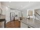 Bright kitchen with stainless steel appliances, white cabinets, and granite countertops at 100 Academy Ln, Canton, GA 30114