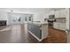 Modern kitchen with white cabinets, stainless steel appliances, and an island at 100 Academy Ln, Canton, GA 30114