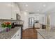 Modern kitchen with granite counters, white cabinets, and stainless steel appliances at 100 Academy Ln, Canton, GA 30114