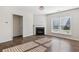 Bright living room with a fireplace and wood-style flooring at 100 Academy Ln, Canton, GA 30114