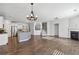 Spacious living area with kitchen, fireplace, and hardwood floors at 100 Academy Ln, Canton, GA 30114