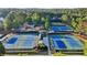 River Green tennis courts surrounded by grass and trees at 100 Academy Ln, Canton, GA 30114