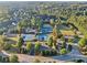 Tennis courts and playground surrounded by grass and trees at 100 Academy Ln, Canton, GA 30114