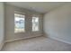 Spacious bedroom with neutral walls and carpeted floor at 246 Arnewood Cir, Mcdonough, GA 30253