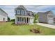 Two-story house with gray siding, white trim, and a two-car garage at 246 Arnewood Cir, Mcdonough, GA 30253