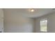 Spacious bedroom with neutral walls and a large window at 565 Teversham Dr, Mcdonough, GA 30253