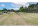 Community dog park with agility features and seating at 565 Teversham Dr, Mcdonough, GA 30253