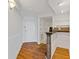 Hardwood floor entryway, white walls and kitchen views at 1501 Clairmont Rd # A, Decatur, GA 30033