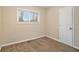 Well-lit bedroom featuring carpet and a closet at 2671 Tilson Rd, Decatur, GA 30032