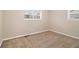 Bright bedroom with neutral walls and carpet at 2671 Tilson Rd, Decatur, GA 30032