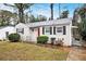 Charming brick ranch home with red door and well-maintained lawn at 2671 Tilson Rd, Decatur, GA 30032