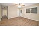 Bright living room with hardwood floors, ceiling fan, and access to backyard at 2671 Tilson Rd, Decatur, GA 30032