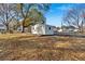 White storage shed in backyard with ramp at 600 Mozley Se Dr, Smyrna, GA 30080