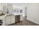 Kitchen features white cabinets, stainless steel appliances, and an island at 4365 Pinehollow Ct, Alpharetta, GA 30022