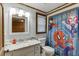 Updated bathroom features granite countertops and a Spiderman shower curtain at 1195 Braselton Hwy, Lawrenceville, GA 30048