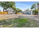 Gravel parking area with two houses and detached garage at 130 South Se Ave, Marietta, GA 30060