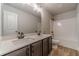 Double vanity bathroom with a quartz countertop and a shower/tub combo at 1414 Alcovy Station Rd, Covington, GA 30014