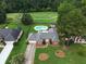 Aerial view of a home with a pool and golf course view at 648 Clubland Se Cir, Conyers, GA 30094