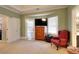 Bedroom with large windows, dresser and a comfy chair at 648 Clubland Se Cir, Conyers, GA 30094