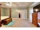 Spacious main bedroom with carpeted floors, large windows, and a walk-in closet at 648 Clubland Se Cir, Conyers, GA 30094