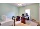 Home office with a desk, chair, and plenty of natural light at 648 Clubland Se Cir, Conyers, GA 30094