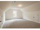 Spacious bonus room with carpeted floor and large window at 1452 Alcovy Station Rd, Covington, GA 30014