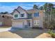 Two-story brick home with gray shutters and a two-car garage at 184 Cabin Way, Hampton, GA 30228