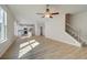 Open concept living room with kitchen and staircase views at 184 Cabin Way, Hampton, GA 30228