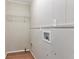 Functional laundry room with shelving and hookups at 6255 Green Acres Sw Dr, Covington, GA 30014