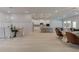 Bright dining room with chandelier and view into the living area at 96 Whites Pond Rd, Moreland, GA 30259