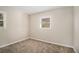 Simple bedroom with window and neutral walls at 195 Pinehurst Dr, Stockbridge, GA 30281