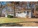 Side view of the house, nestled among trees at 195 Pinehurst Dr, Stockbridge, GA 30281
