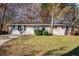 House exterior showcasing a well-maintained lawn at 195 Pinehurst Dr, Stockbridge, GA 30281