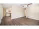 Open living area with kitchen access and wood-look floors at 195 Pinehurst Dr, Stockbridge, GA 30281