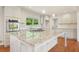 Bright white kitchen with granite countertops, stainless steel appliances, and an island at 1097 Chatsworth Dr, Avondale Estates, GA 30002