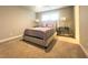 Comfortable bedroom with plush carpet and a queen-size bed at 184 Camdale Ct, Mcdonough, GA 30252