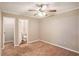 Bright bedroom featuring ceiling fan and en-suite bathroom access at 2791 Mcafee Rd, Decatur, GA 30032