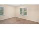 Spacious bedroom with neutral carpeting and large windows at 2791 Mcafee Rd, Decatur, GA 30032