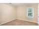 Simple bedroom with neutral walls and carpet at 2791 Mcafee Rd, Decatur, GA 30032