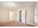 Bright bedroom with carpet flooring and a double door closet at 2791 Mcafee Rd, Decatur, GA 30032