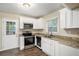 Well-equipped kitchen with white cabinets and granite countertops at 2791 Mcafee Rd, Decatur, GA 30032