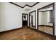 Bedroom with hardwood floors and mirrored closet at 20 Marietta Nw St # 4D, Atlanta, GA 30303