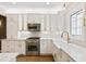 Renovated kitchen, white cabinets, quartz counters at 53 Paces West Dr, Atlanta, GA 30327