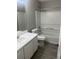 Clean bathroom with white vanity and tub/shower combo at 6090 Kingston Ln, Mcdonough, GA 30253