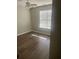 Well-lit bedroom with hardwood floors and a window at 6090 Kingston Ln, Mcdonough, GA 30253