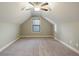 Bright bedroom with vaulted ceiling, carpet, and window at 7042 Confederate Ct, Villa Rica, GA 30116