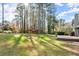 Large backyard with playset and treehouse at 1058 Gate Post Ln, Lawrenceville, GA 30044