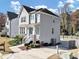 Gray house with white trim, stone accents, and a driveway at 2608 Tilson Rd, Decatur, GA 30032